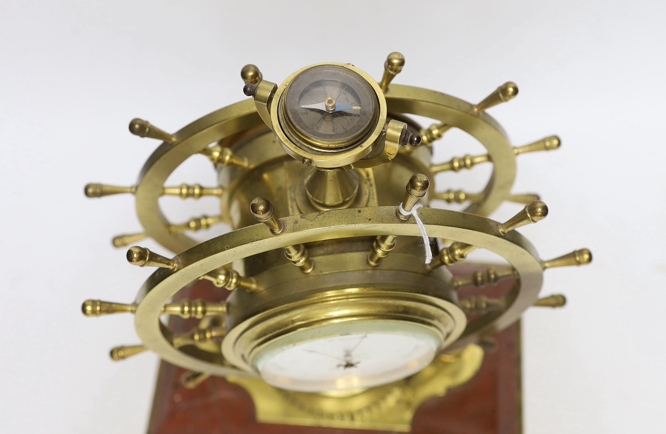 A late Victorian brass and marble ship's wheel timepiece with aneroid barometer and compass, 29.5cm